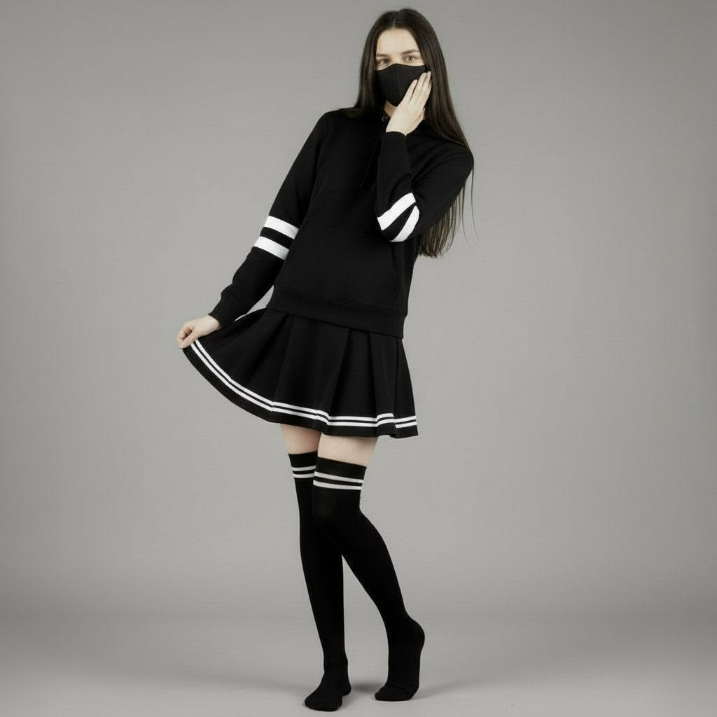 Person wearing a black hoodie with white stripes on a gray background