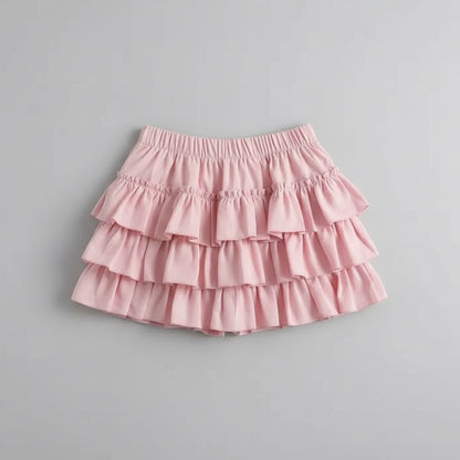 Pink ruffled skirt on a gray background